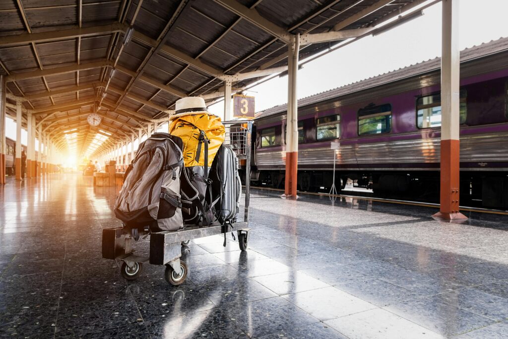 pexels photo 1170187 1170187 A traveler's baggage cart on an urban railway station platform at sunrise.